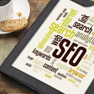 tablet with word cloud of SEO terms